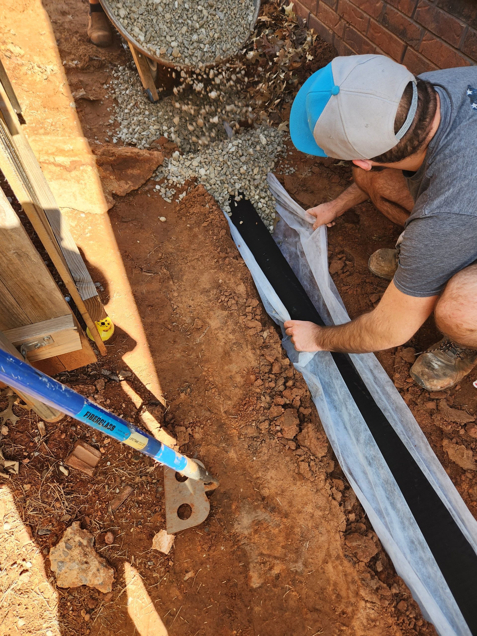 Installing Trench Liner for French Drain
